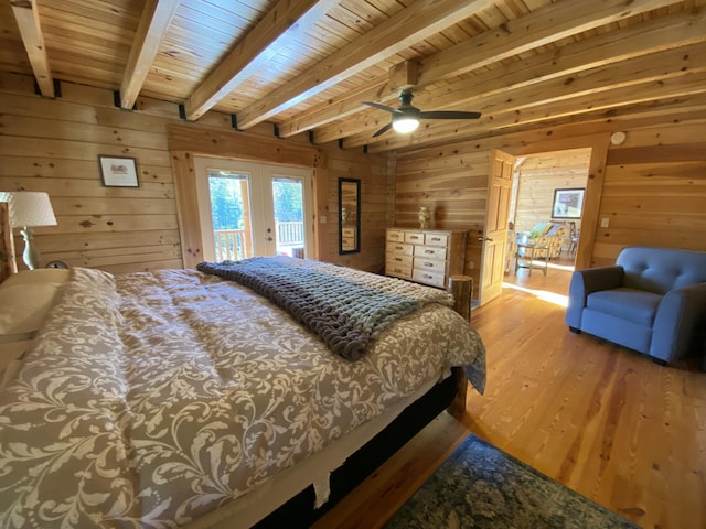 431 Harold Luke Rd, Campton, KY 41301 - bedroom with access to exterior, french doors, wood finished floors, wooden walls, and wood ceiling with exposed beams
