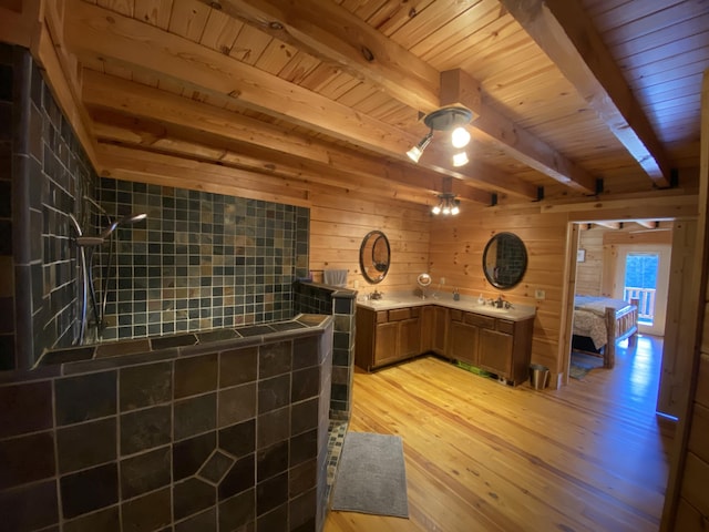 431 Harold Luke Rd, Campton, KY 41301 - kitchen with wood ceiling with exposed beams, a sink, brown cabinets, light wood-style floors, and wooden walls