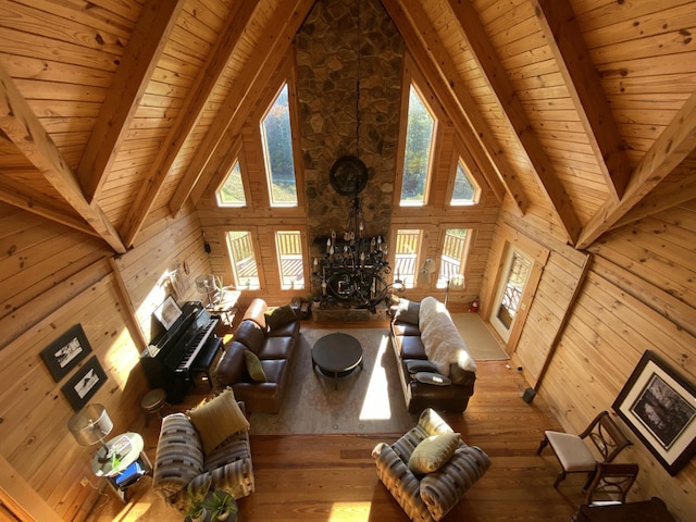 431 Harold Luke Rd, Campton, KY 41301 - living room with wood ceiling with exposed beams, wooden walls, high vaulted ceiling, wood-type flooring, and plenty of natural light