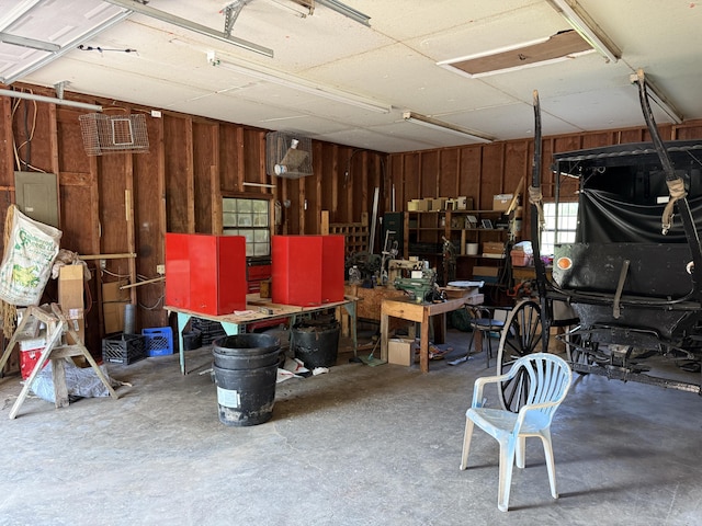 1034 Duncan Valley Rd, Monticello, KY 42633 - garage with a workshop area and wood walls