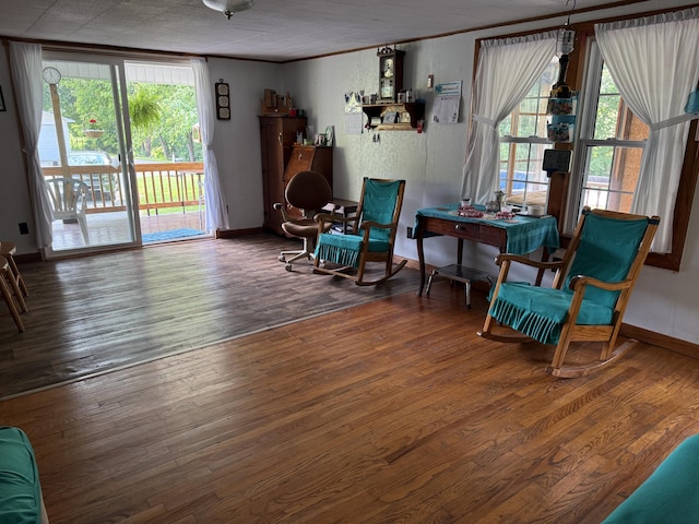 1034 Duncan Valley Rd, Monticello, KY 42633 - living area with ornamental molding, wood finished floors, plenty of natural light, and baseboards