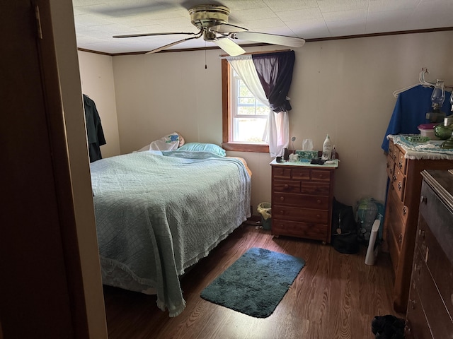 1034 Duncan Valley Rd, Monticello, KY 42633 - bedroom with wood finished floors, crown molding, and a ceiling fan