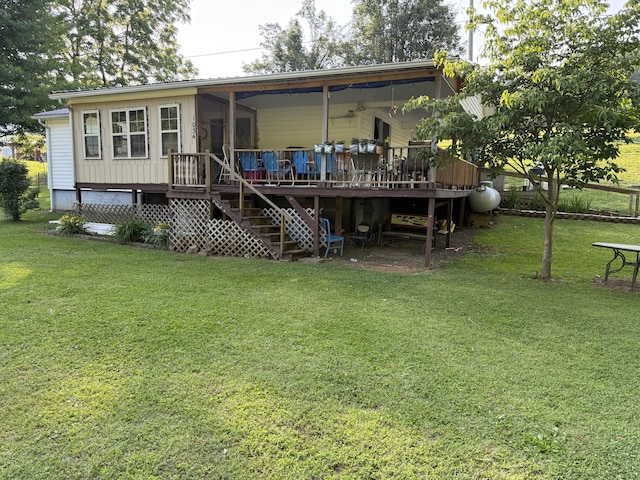 1034 Duncan Valley Rd, Monticello, KY 42633 - rear view of house featuring stairs, a yard, and a wooden deck
