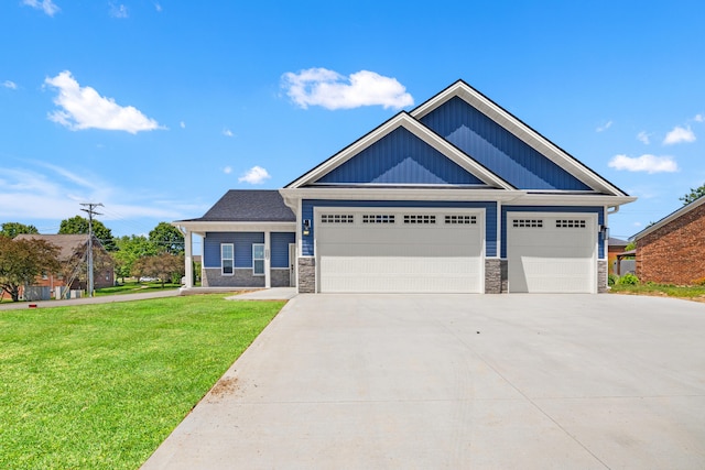 1038 Tamworth Ln, Frankfort, KY 40601 - view of front of house with stone siding, driveway, an attached garage, and a front lawn