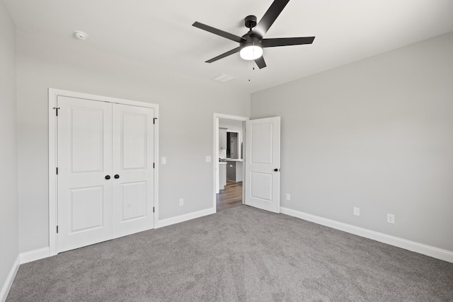 1038 Tamworth Ln, Frankfort, KY 40601 - unfurnished bedroom featuring carpet flooring, a closet, baseboards, and a ceiling fan
