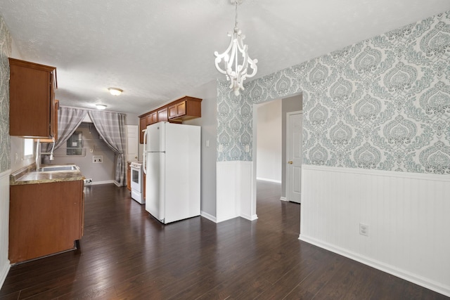 966 Jairus Dr, Lexington, KY 40515 - kitchen featuring white appliances, wallpapered walls, wainscoting, dark wood finished floors, and brown cabinetry