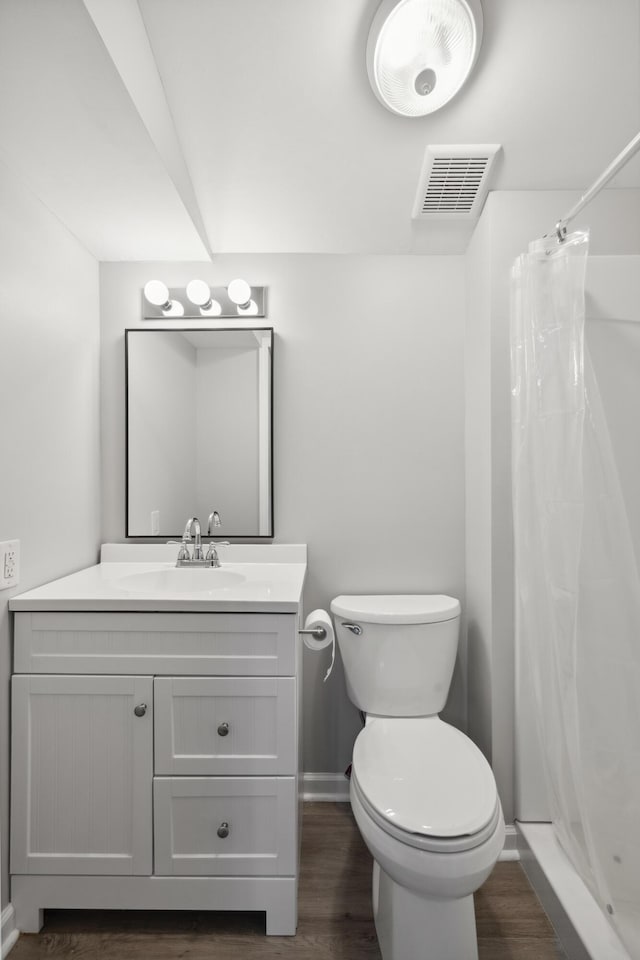 966 Jairus Dr, Lexington, KY 40515 - bathroom with toilet, vanity, wood finished floors, baseboards, and a shower with curtain