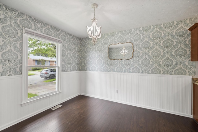 966 Jairus Dr, Lexington, KY 40515 - unfurnished dining area featuring a chandelier, wainscoting, wood finished floors, and wallpapered walls