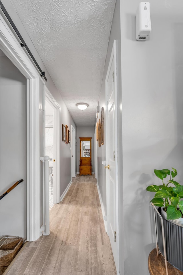 208 Westmoreland Ct, Georgetown, KY 40324 - corridor featuring light wood-type flooring and a textured ceiling