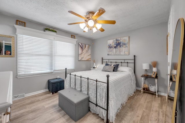 208 Westmoreland Ct, Georgetown, KY 40324 - bedroom featuring light wood-style floors, a textured ceiling, baseboards, and ceiling fan