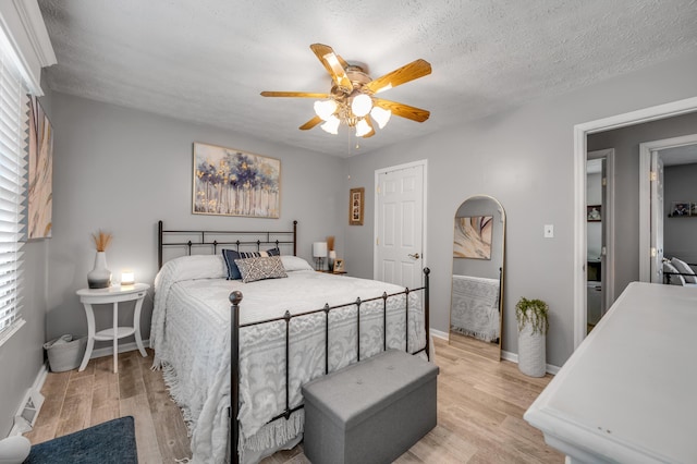 208 Westmoreland Ct, Georgetown, KY 40324 - bedroom with light wood finished floors, baseboards, and ceiling fan