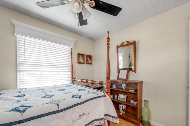 208 Westmoreland Ct, Georgetown, KY 40324 - bedroom featuring a ceiling fan, a textured ceiling, and wood finished floors
