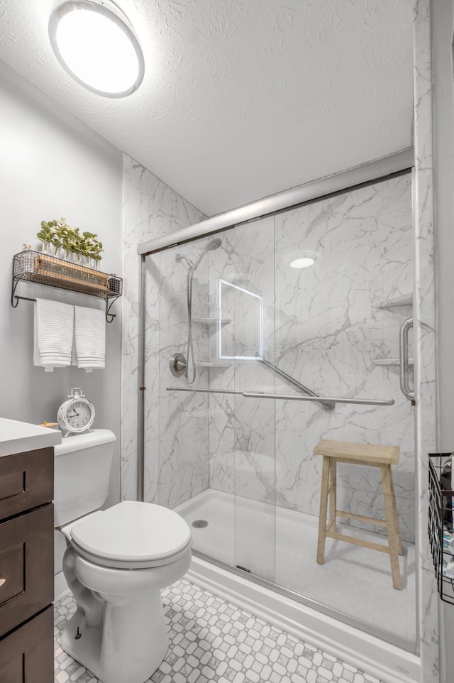 208 Westmoreland Ct, Georgetown, KY 40324 - bathroom with a textured ceiling, vanity, toilet, and a marble finish shower