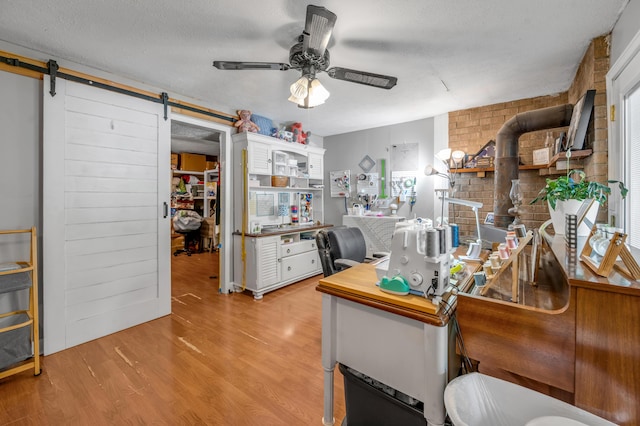 208 Westmoreland Ct, Georgetown, KY 40324 - office featuring a ceiling fan, a barn door, and light wood finished floors