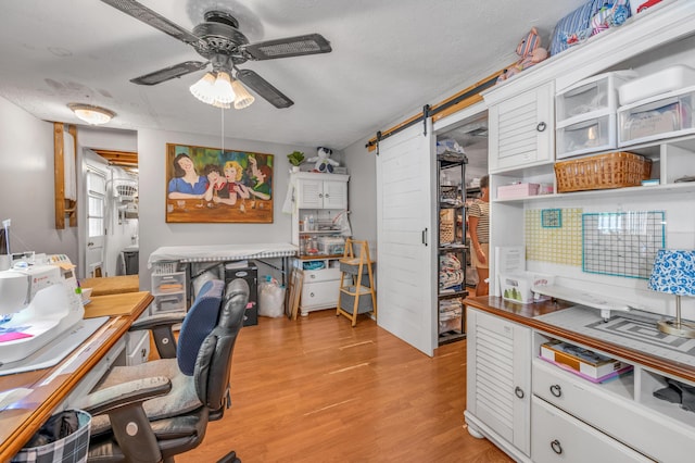 208 Westmoreland Ct, Georgetown, KY 40324 - office area featuring a barn door, a ceiling fan, and light wood finished floors
