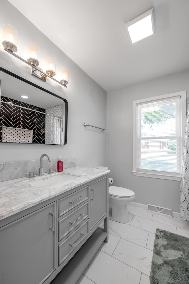 1626 Raleigh Rd, Lexington, KY 40505 - full bath with marble finish floors, vanity, and a shower with curtain