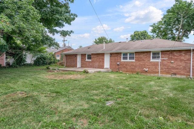1626 Raleigh Rd, Lexington, KY 40505 - rear view of property with a patio area, brick siding, a yard, and a shingled roof