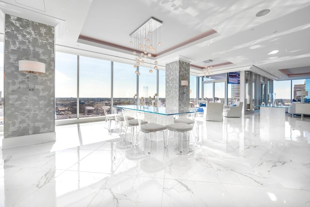 103 S Limestone St Unit 1150, Lexington, KY 40507 - dining space with a tray ceiling, expansive windows, healthy amount of natural light, marble tiled floors, and a chandelier