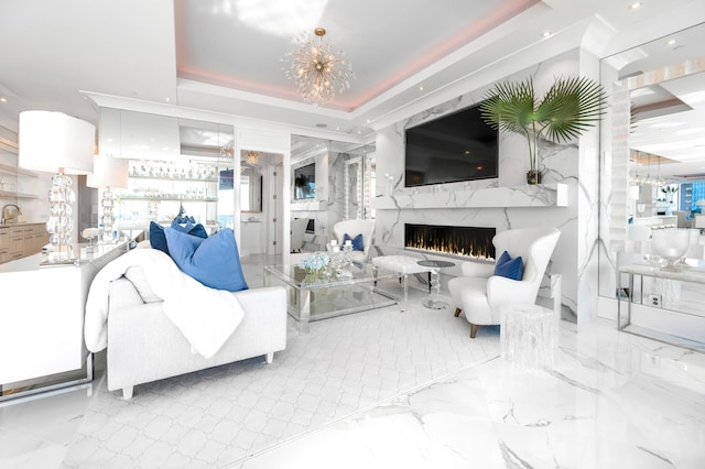 103 S Limestone St Unit 1150, Lexington, KY 40507 - living room with a chandelier, a high end fireplace, recessed lighting, plenty of natural light, and a raised ceiling