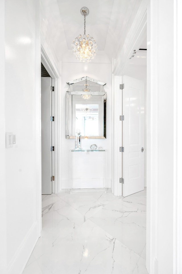 103 S Limestone St Unit 1150, Lexington, KY 40507 - hallway featuring a chandelier, marble tiled floors, and baseboards