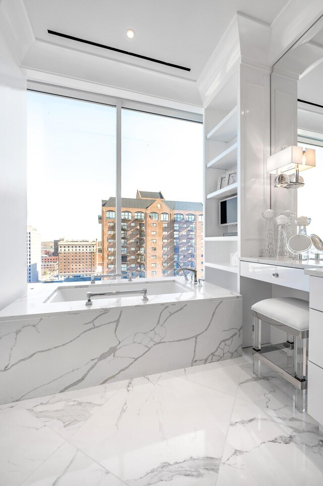 103 S Limestone St Unit 1150, Lexington, KY 40507 - full bathroom featuring a garden tub, marble tiled flooring, vanity, and a city view