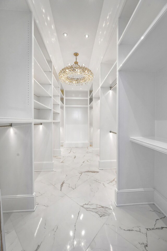 103 S Limestone St Unit 1150, Lexington, KY 40507 - walk in closet featuring marble tiled flooring and a chandelier