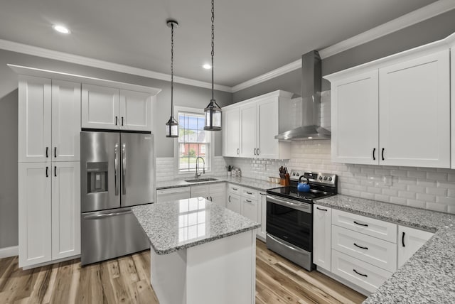 559 Breckenridge St, Lexington, KY 40508 - kitchen with stainless steel appliances, wall chimney exhaust hood, a sink, ornamental molding, and white cabinetry