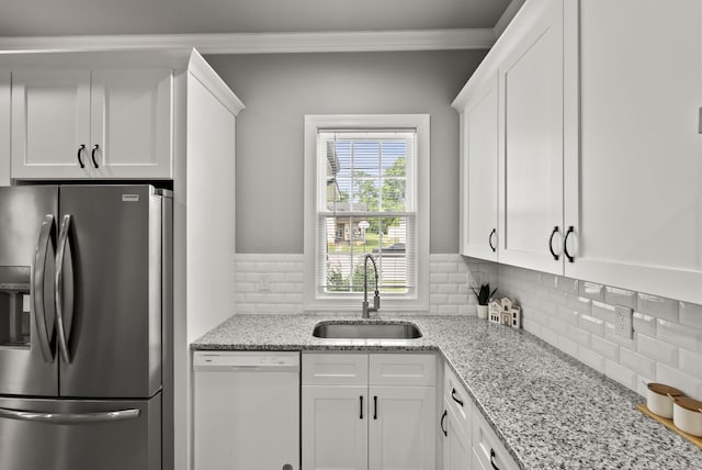 559 Breckenridge St, Lexington, KY 40508 - kitchen with stainless steel fridge, dishwasher, a sink, white cabinetry, and backsplash