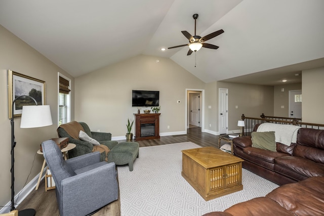 504 Martin Dr, Richmond, KY 40475 - living room featuring a ceiling fan, wood finished floors, lofted ceiling, a glass covered fireplace, and baseboards