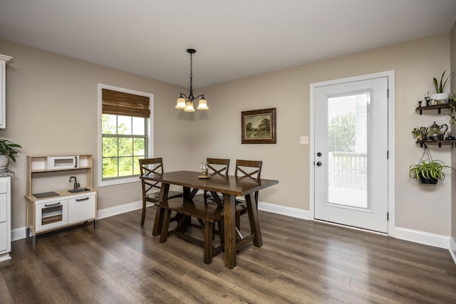504 Martin Dr, Richmond, KY 40475 - dining room with dark wood finished floors, baseboards, and a chandelier