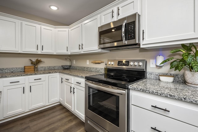 504 Martin Dr, Richmond, KY 40475 - kitchen featuring stainless steel appliances, white cabinets, dark wood-type flooring, light stone countertops, and recessed lighting