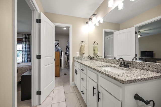 504 Martin Dr, Richmond, KY 40475 - full bathroom featuring double vanity, a ceiling fan, baseboards, and a walk in closet