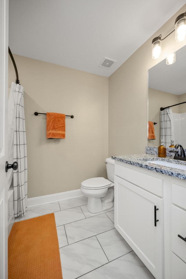 504 Martin Dr, Richmond, KY 40475 - full bathroom featuring vanity, marble look tile flooring, toilet, a shower with curtain, and baseboards