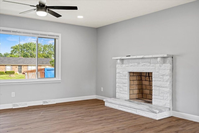 113 Buckwood Dr, Richmond, KY 40475 - unfurnished living room featuring wood finished floors, baseboards, a ceiling fan, a stone fireplace, and recessed lighting