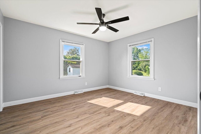 113 Buckwood Dr, Richmond, KY 40475 - spare room featuring plenty of natural light, wood finished floors, and baseboards