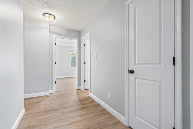 113 Buckwood Dr, Richmond, KY 40475 - hall featuring baseboards, light wood finished floors, and a textured ceiling