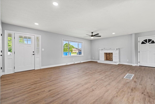 113 Buckwood Dr, Richmond, KY 40475 - unfurnished living room with wood finished floors, plenty of natural light, a ceiling fan, recessed lighting, and baseboards