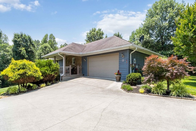 21 Vicki St, Nancy, KY 42544 - ranch-style home with a garage, concrete driveway, and a porch