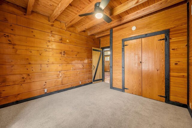372 Sussex Ln, Nicholasville, KY 40356 - unfurnished bedroom featuring wooden ceiling with exposed beams, carpet, wooden walls, and a ceiling fan