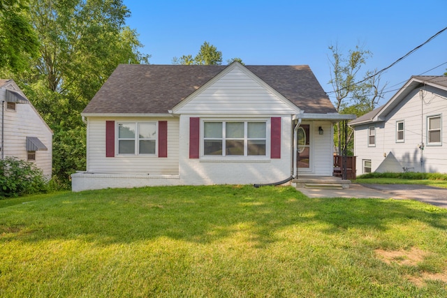 710 E Main St, Danville, KY 40422 - view of front of property featuring a shingled roof, a front yard, and brick siding