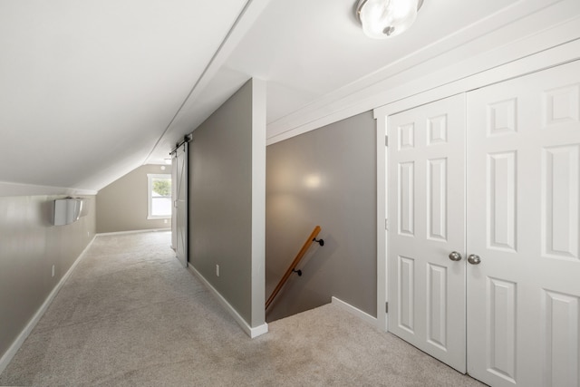 710 E Main St, Danville, KY 40422 - hallway with an upstairs landing, light colored carpet, vaulted ceiling, and baseboards