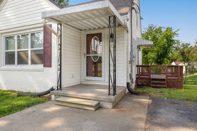 710 E Main St, Danville, KY 40422 - view of exterior entry with brick siding and a wooden deck
