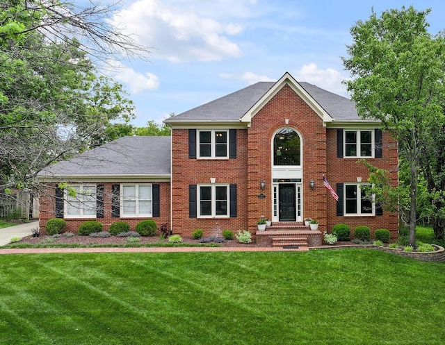 2245 Abbeywood Rd, Lexington, KY 40515 - colonial home featuring a front yard, brick siding, and a shingled roof