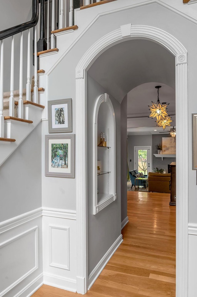 2245 Abbeywood Rd, Lexington, KY 40515 - hallway featuring light wood-style floors, arched walkways, and stairway