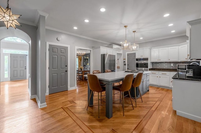 2245 Abbeywood Rd, Lexington, KY 40515 - dining room featuring a chandelier, recessed lighting, ornamental molding, baseboards, and light wood-style floors