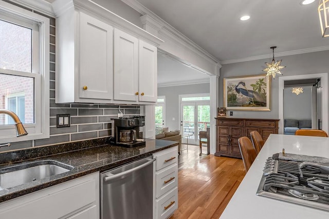 2245 Abbeywood Rd, Lexington, KY 40515 - kitchen with stainless steel appliances, a sink, crown molding, white cabinets, and light wood-type flooring