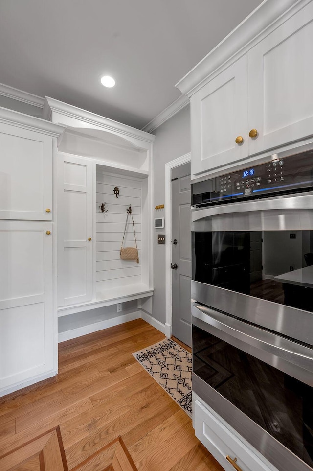 2245 Abbeywood Rd, Lexington, KY 40515 - mudroom with crown molding, light wood-style floors, recessed lighting, and baseboards