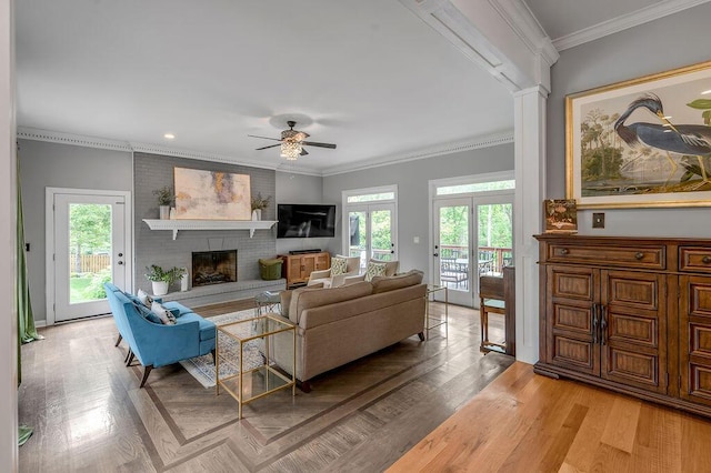 2245 Abbeywood Rd, Lexington, KY 40515 - living room with a ceiling fan, a brick fireplace, light wood-style floors, and crown molding