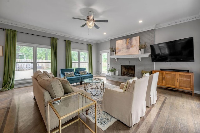2245 Abbeywood Rd, Lexington, KY 40515 - living room with ornamental molding, a ceiling fan, a fireplace, wood finished floors, and recessed lighting