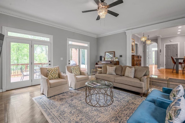 2245 Abbeywood Rd, Lexington, KY 40515 - living area with ornamental molding, ceiling fan, arched walkways, light wood finished floors, and baseboards